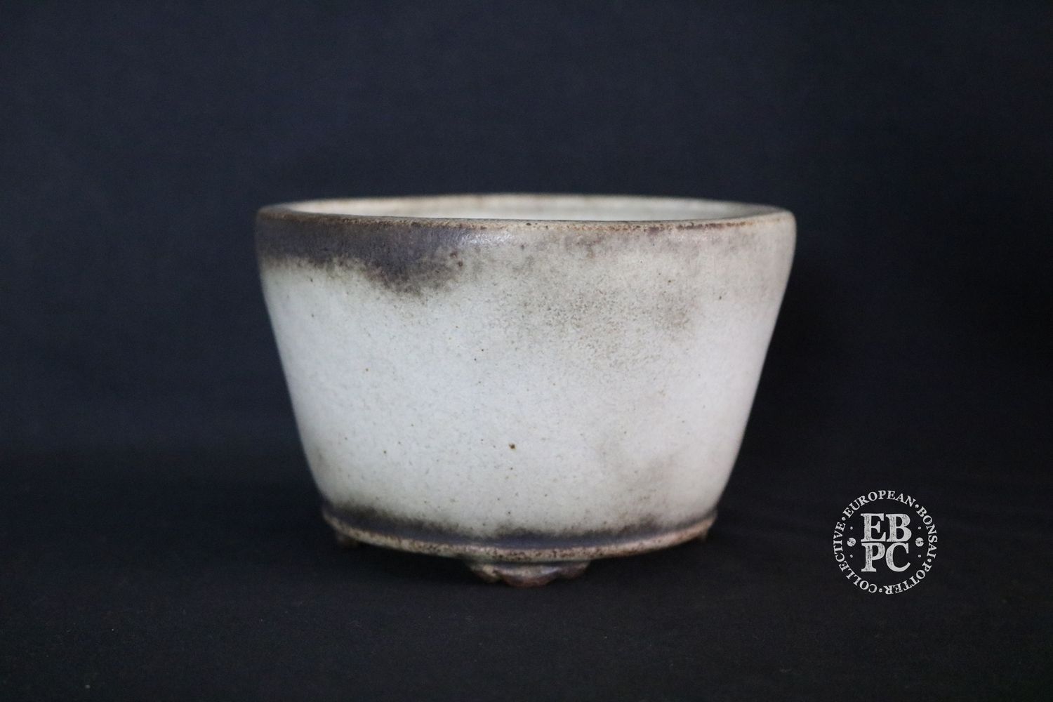 Ian Baillie - 13.3cm; Round; Delicate Design &amp; Build; Superb Glaze; Antique White; Scroll Feet; Basal Band.       Made by Ian Baillie of Scotland.