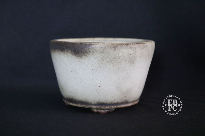Ian Baillie - 13.3cm; Round; Delicate Design &amp; Build; Superb Glaze; Antique White; Scroll Feet; Basal Band.       Made by Ian Baillie of Scotland.