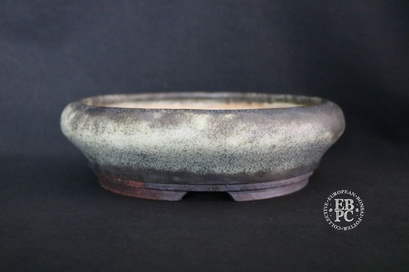 Ian Baillie - 24.5cm; Round; Elegant Design; Superb Antique Mottled Glaze; Cream & Mint Green; Charcoal; Brown; Basal Band. Made by Ian Baillie of Scotland.