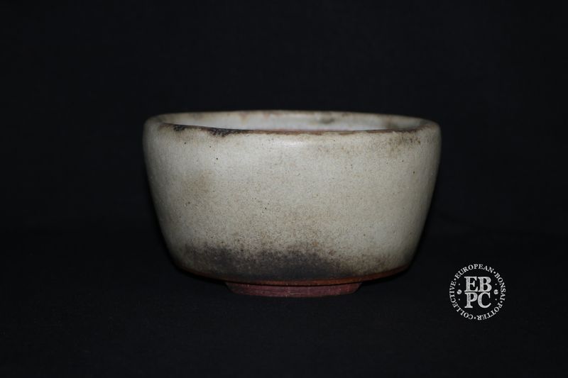 Ian Baillie - 16cm; Round; Semi Cascade; Superb Antique White Glaze; Charcoal Grey; Basal Band.       Made by Ian Baillie of Scotland.