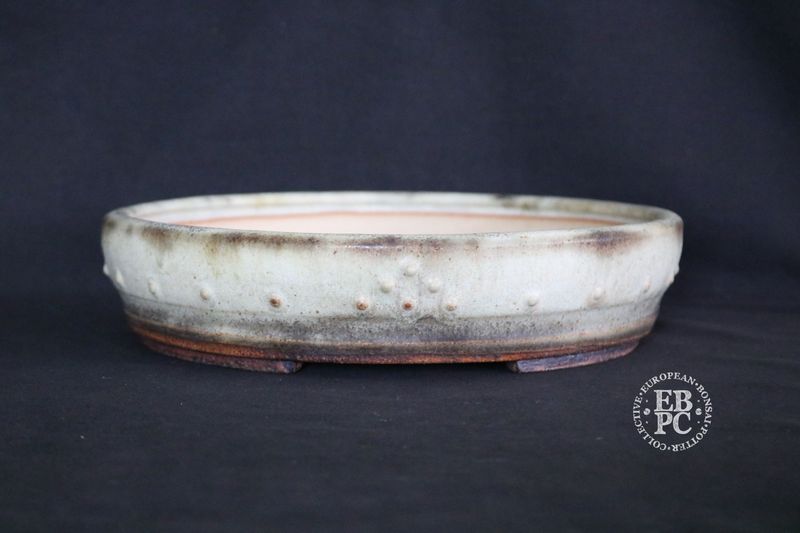 Ian Baillie - 26.7cm; Round; Drum Style; Superb Aged-looking Glaze; Rivets/Studs; Light Mint Green; Cream; Browns; Made by Ian Baillie of Scotland. Ian Baillie - 26.7cm; Round; Drum Style; Superb Aged-looking Glaze; Rivets/Studs; Light Mint Green; Cream; Browns; Made by Ian Baillie of Scotland.