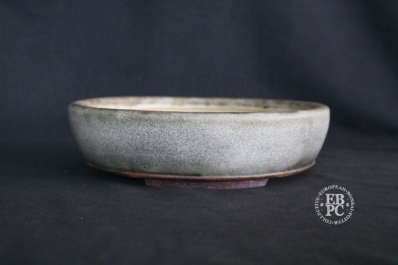 Ian Baillie - 24cm; Round; Antique Crackle Glaze; Cream; Grey; Charcoal; Basal Band.  EBPC Stamped.          Made by Ian Baillie of Scotland.