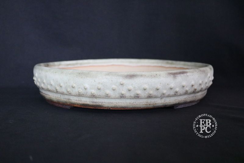 Ian Baillie - 32.1cm; Round; Drum Style; Superb Aged-looking Glaze; Rivets/Studs; Ivory/Bone; Light Mint Green; Browns; Made by Ian Baillie of Scotland.
