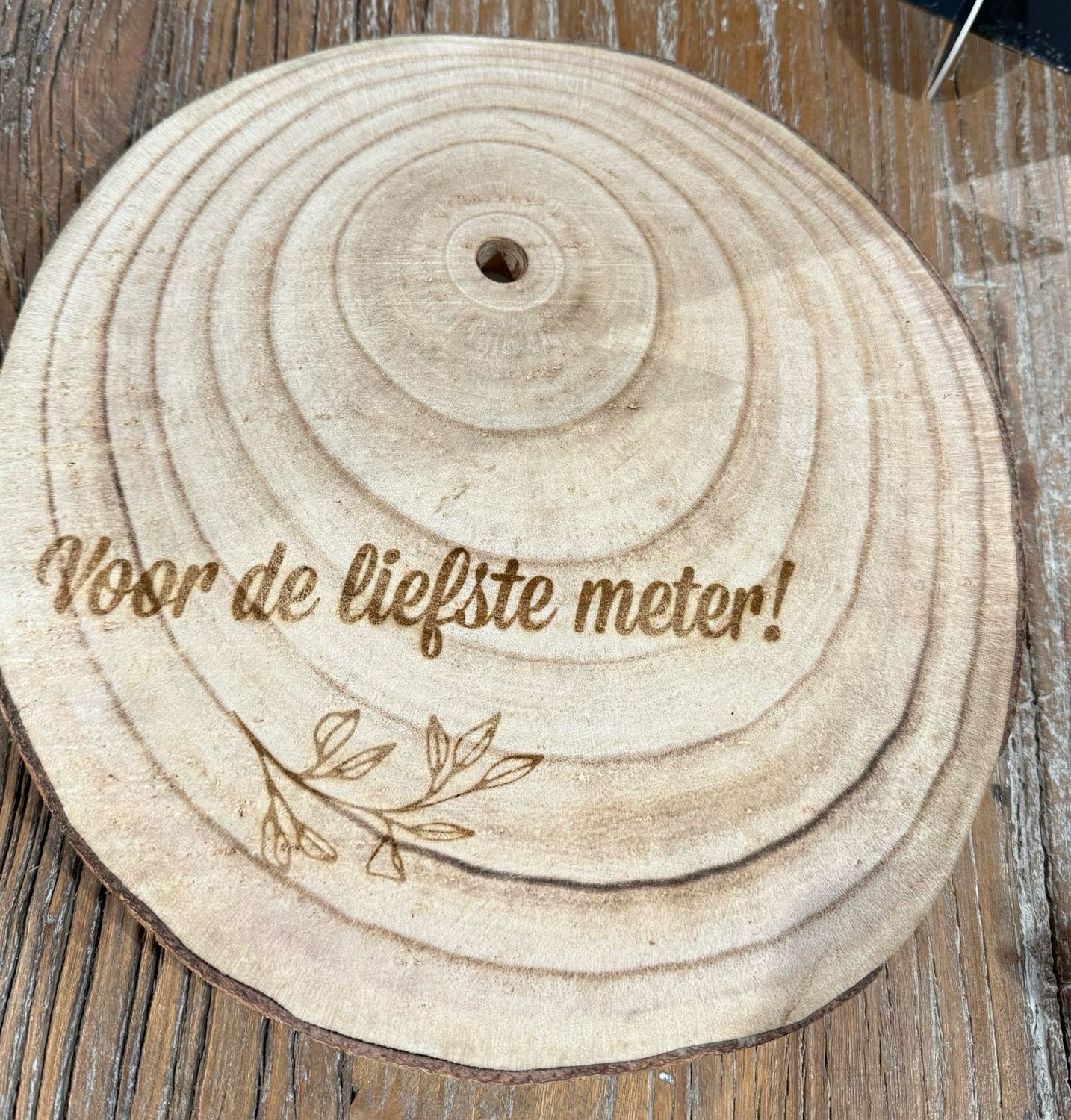 Houten schijf gegraveerd