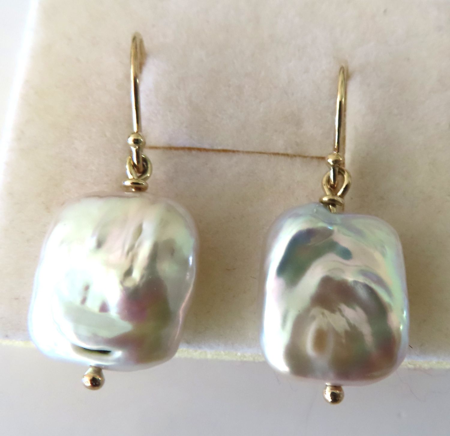 White freshwater pearl earrings off 9ct yellow gold hooks