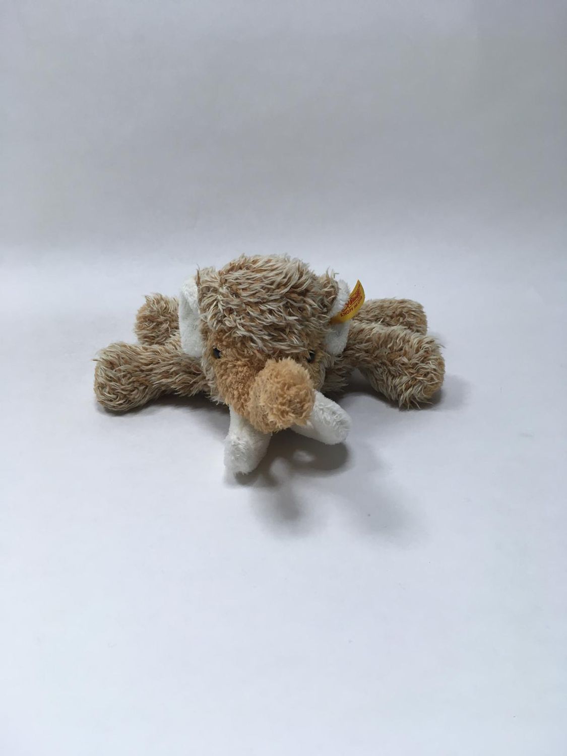 Steiff Mammut 082375 mit Knopf und Fahne liegend 30 cm Sammlerstück