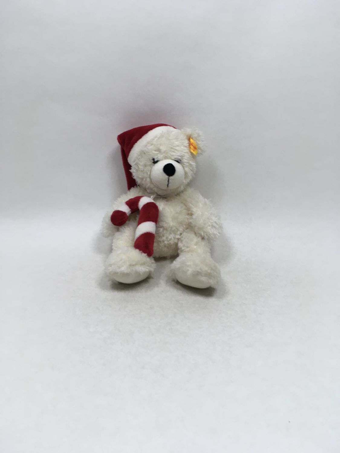 Steiff Teddy Weihnachtsbär 111518 mit Knopf und Fahne stehend 28 cm Sammlerstück