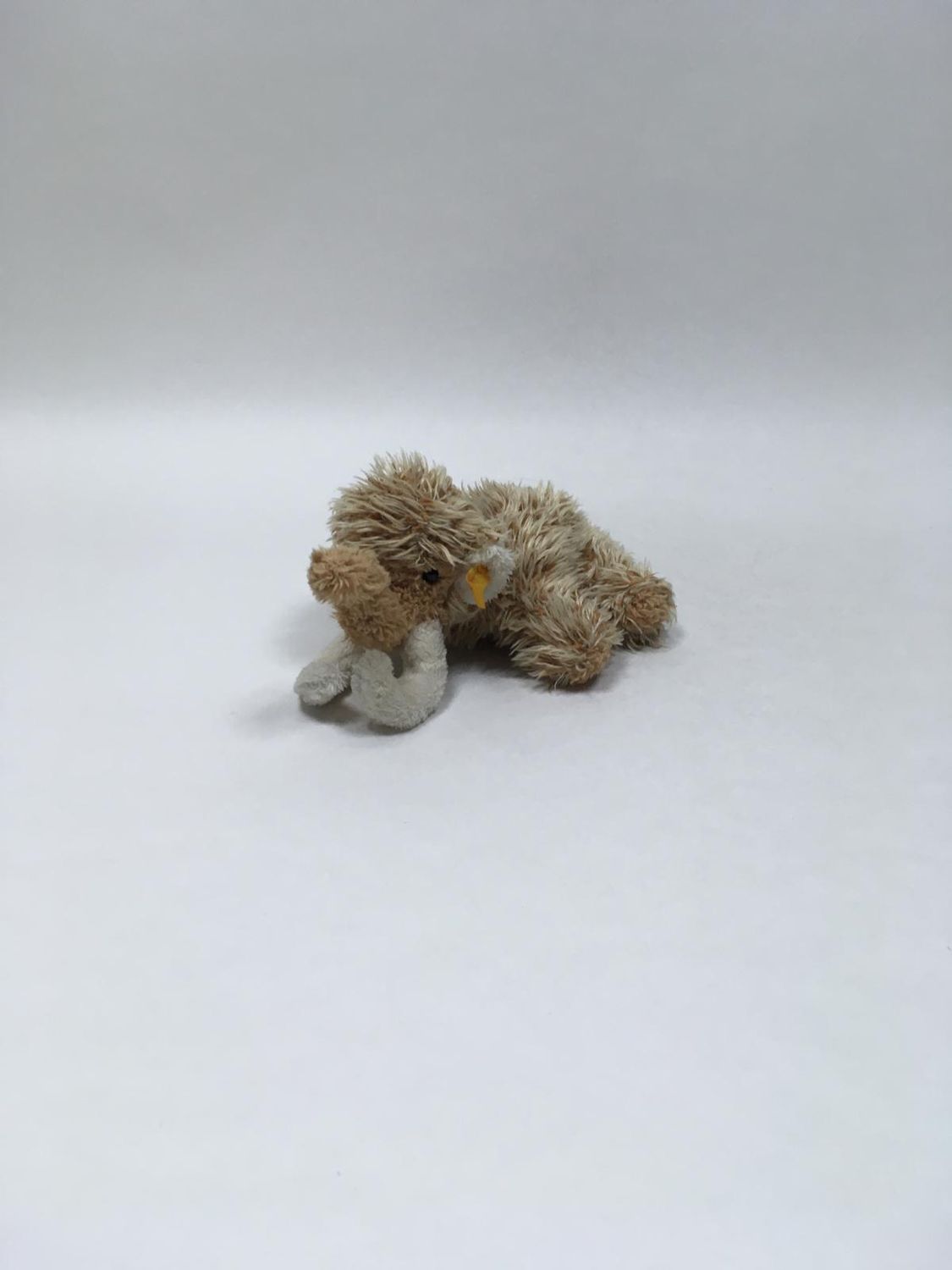 Steiff Mammut 110382 mit Knopf und Fahne liegend 23 cm sehr selten