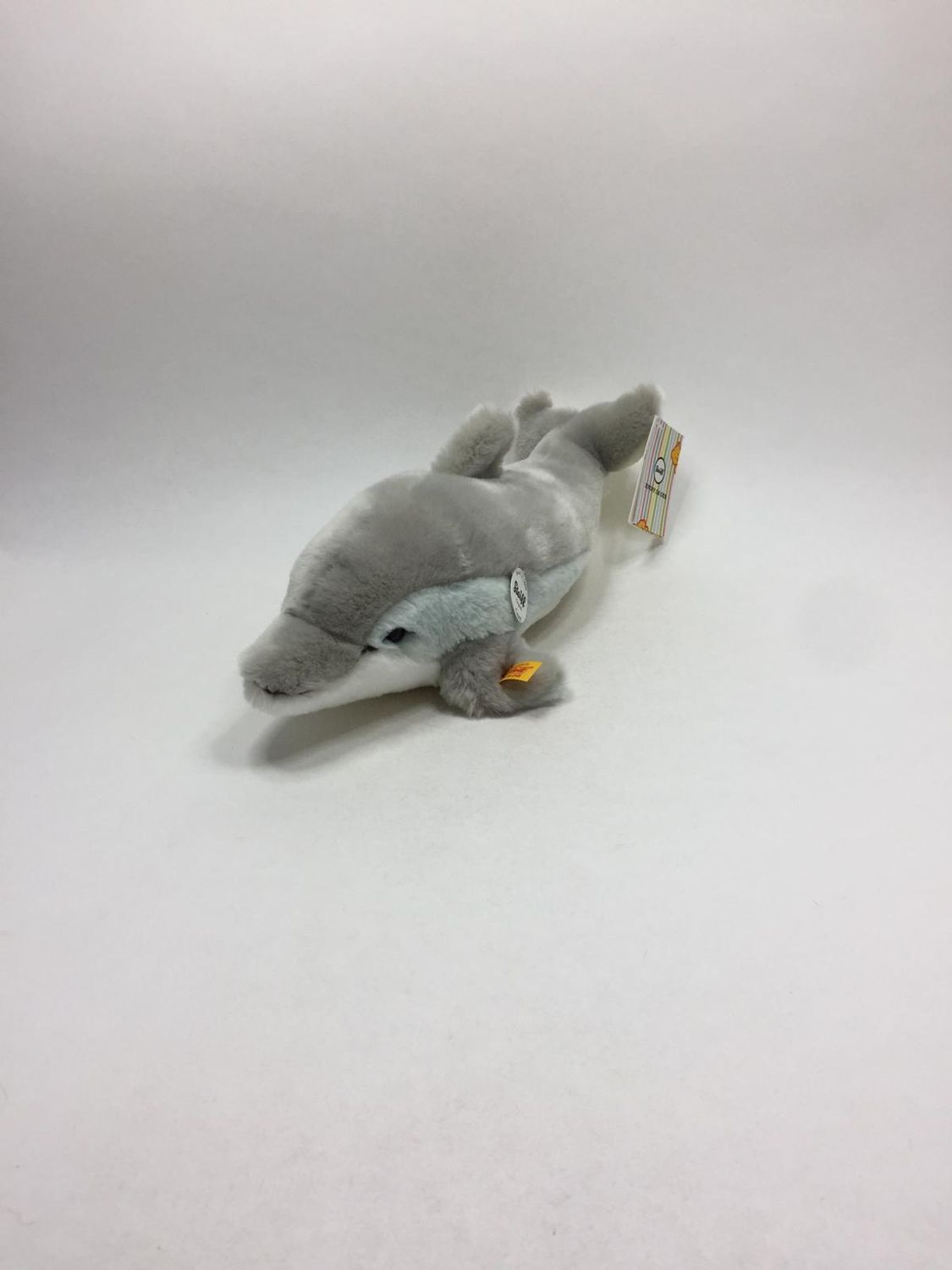 Steiff Delfin Cappy 063183 mit Knopf, Fahne und Brustschild liegend 35 cm Neuwertig mit Etikett