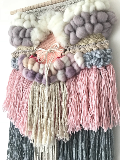 Medium woven wall hanging  30 cm wide.