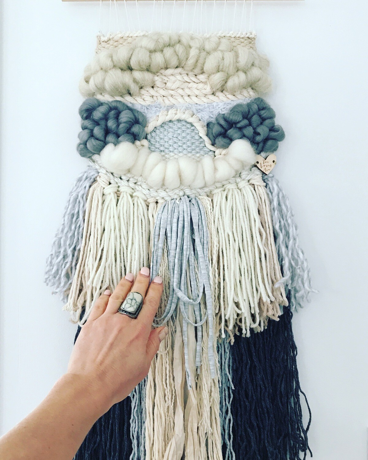 Small woven wall hanging 20 cm wide.