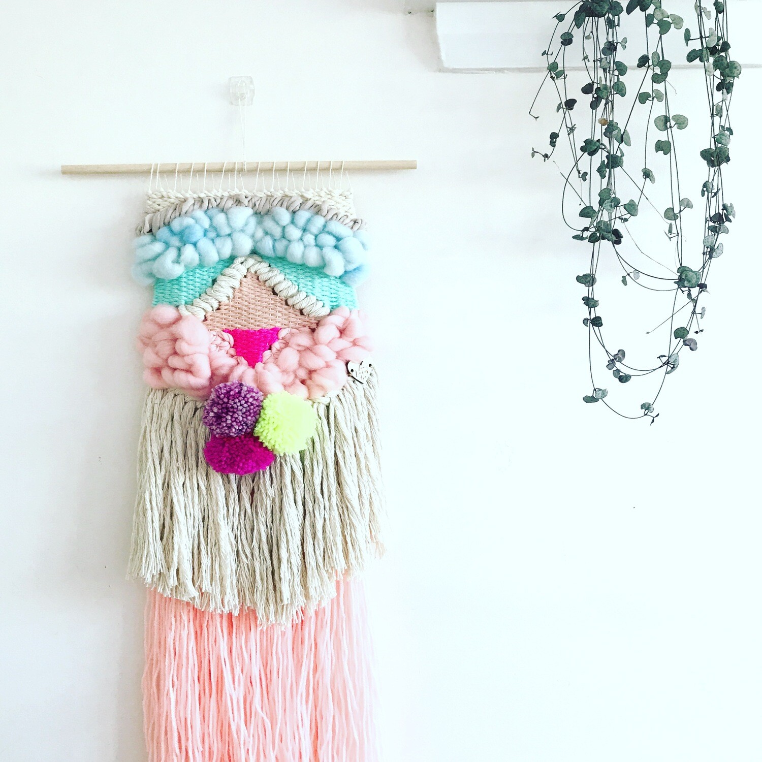 Small woven wall hanging 20 cm wide.