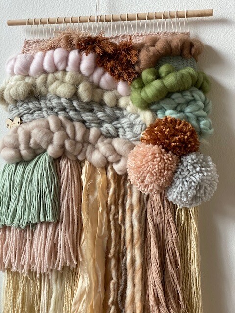 Small  woven wall hanging 25 cm wide.