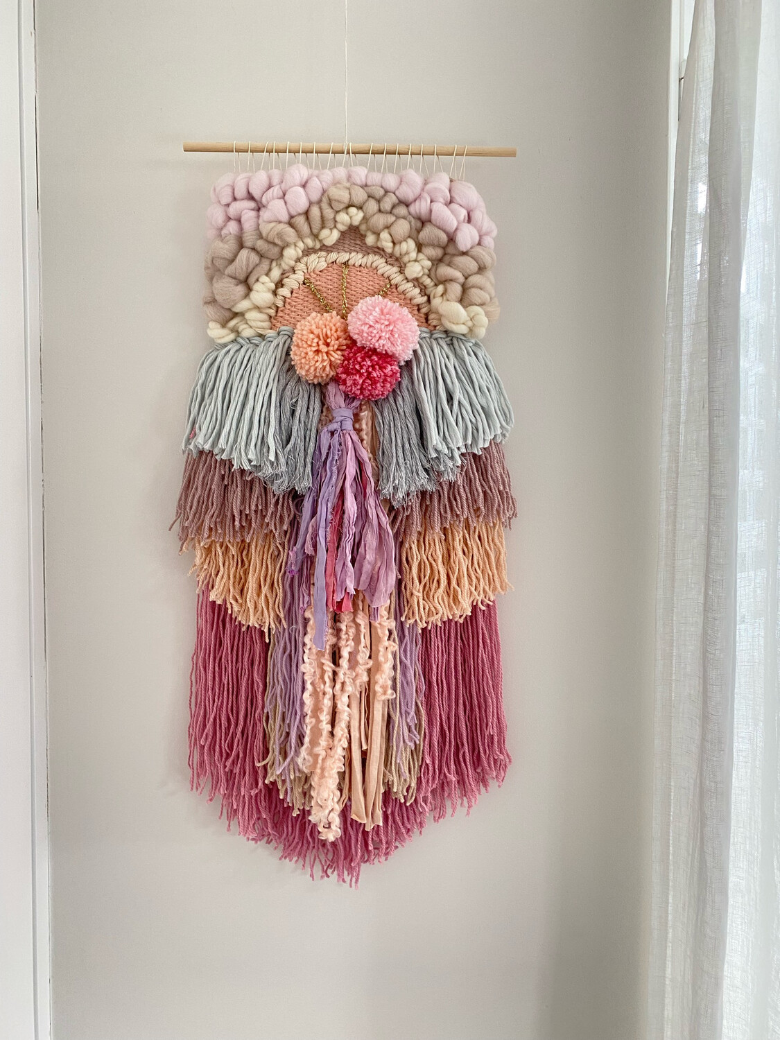 Small woven wall hanging 20 cm wide.