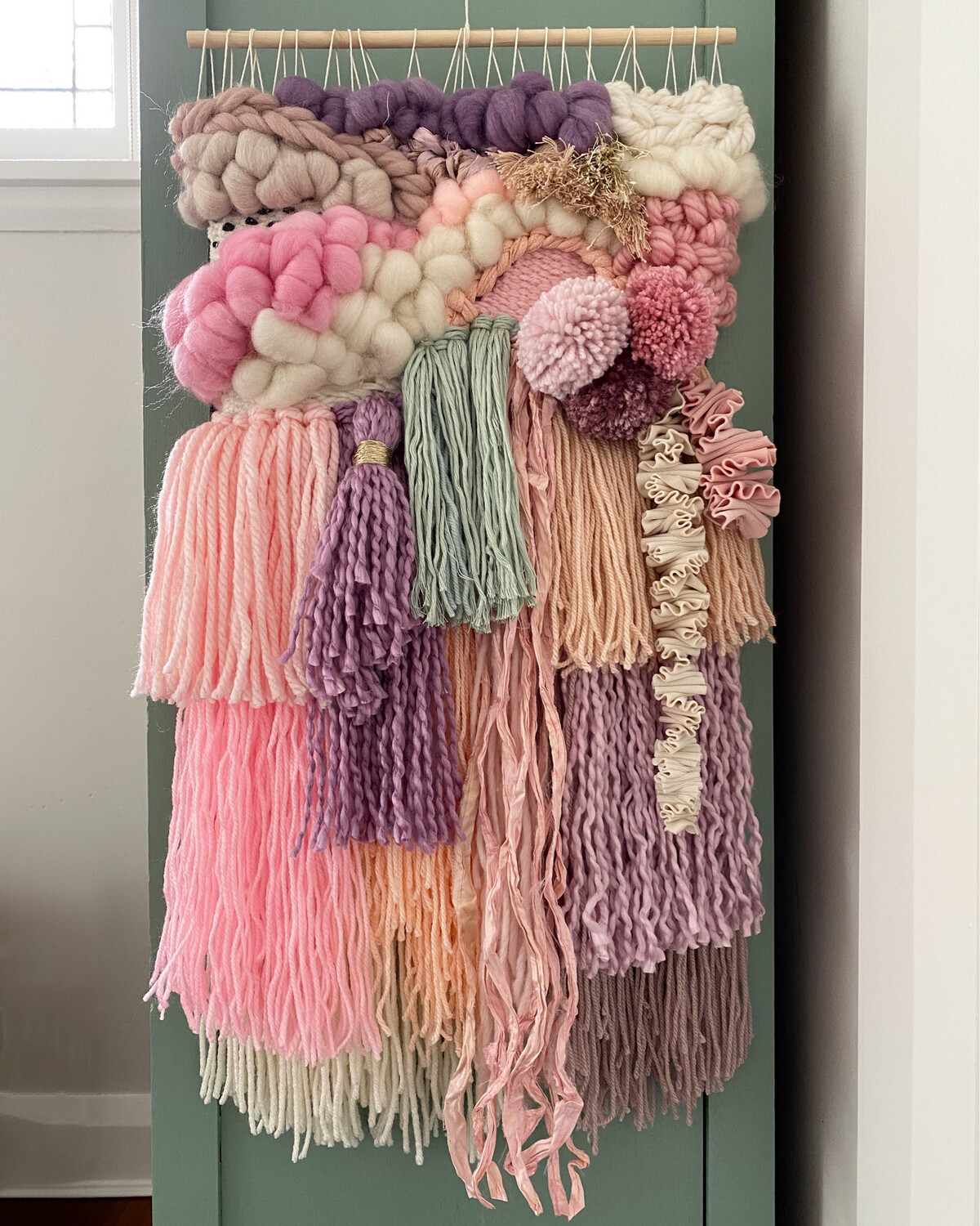 Small  woven wall hanging 25 cm wide.