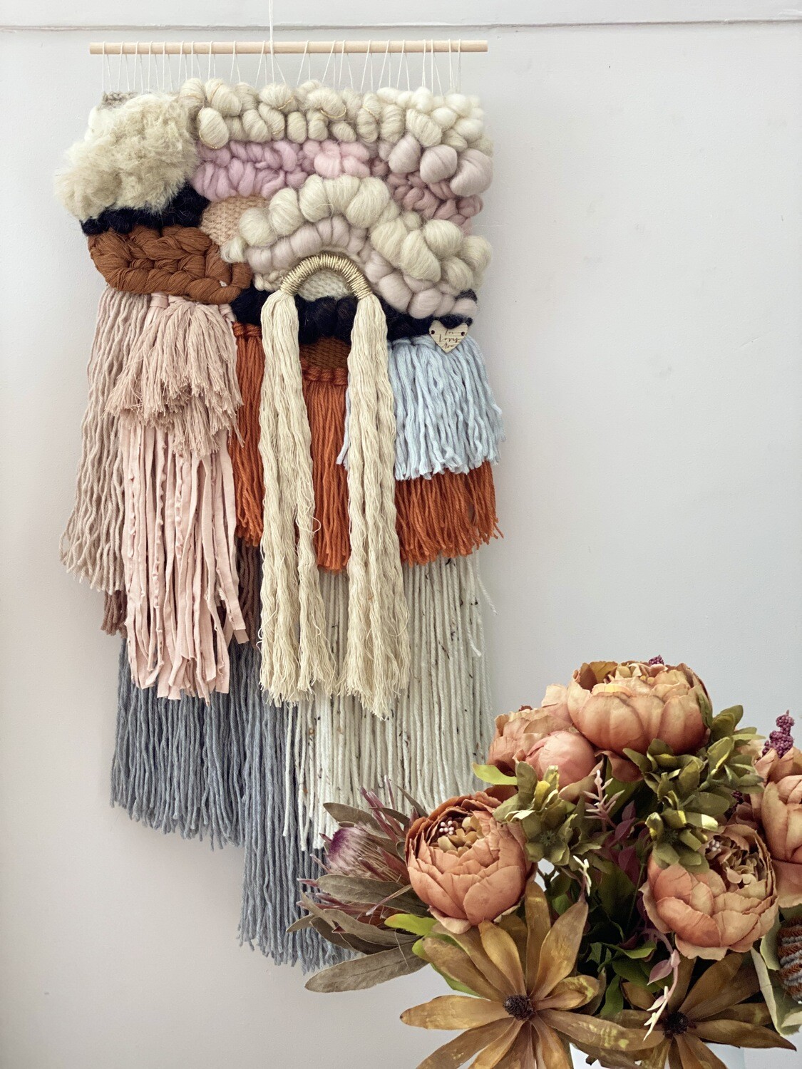 Small  woven wall hanging 25 cm wide.