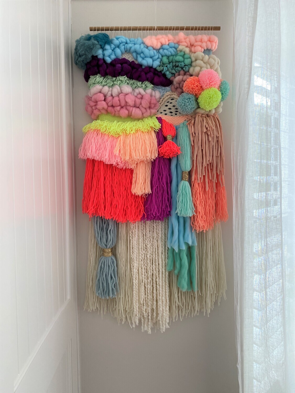Medium woven wall hanging 40 cm wide.