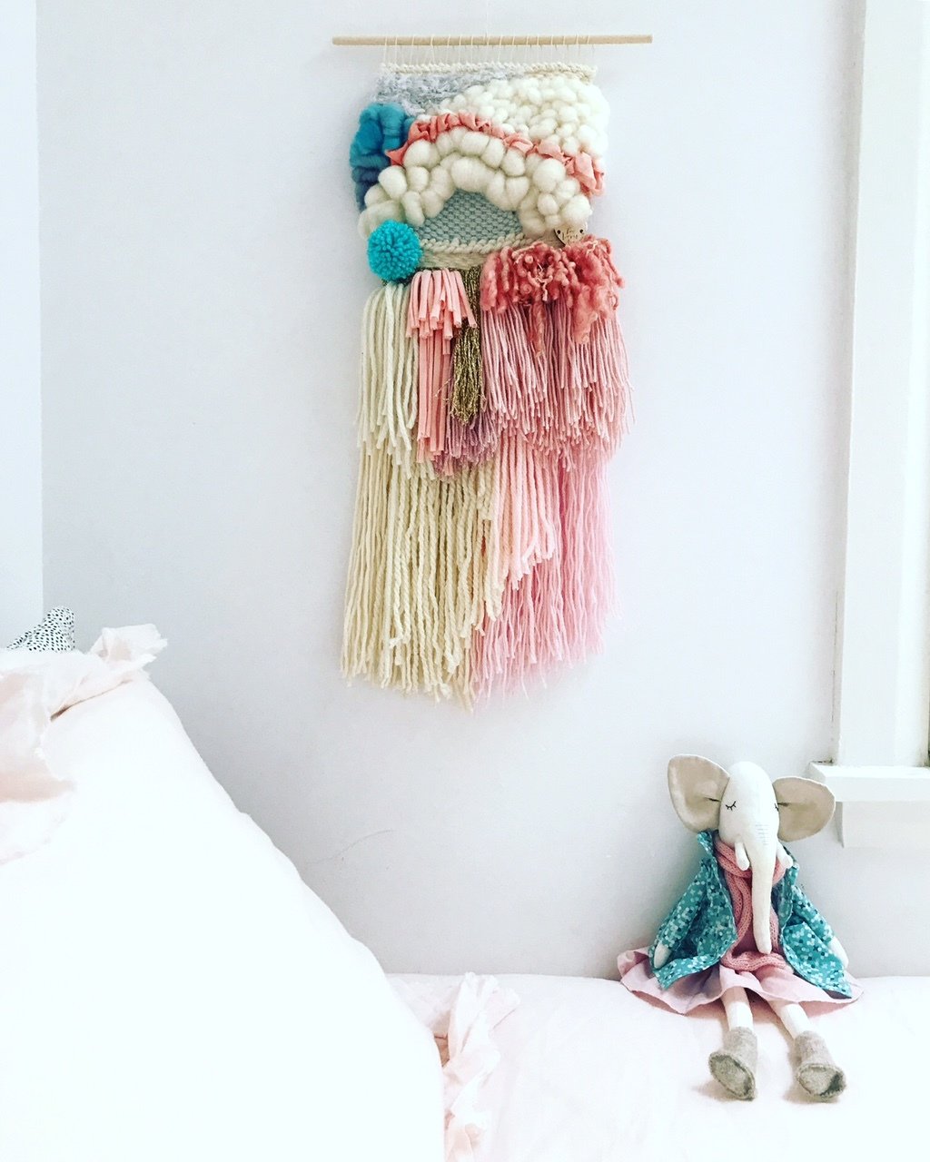 Small woven wall hanging 20 cm wide.