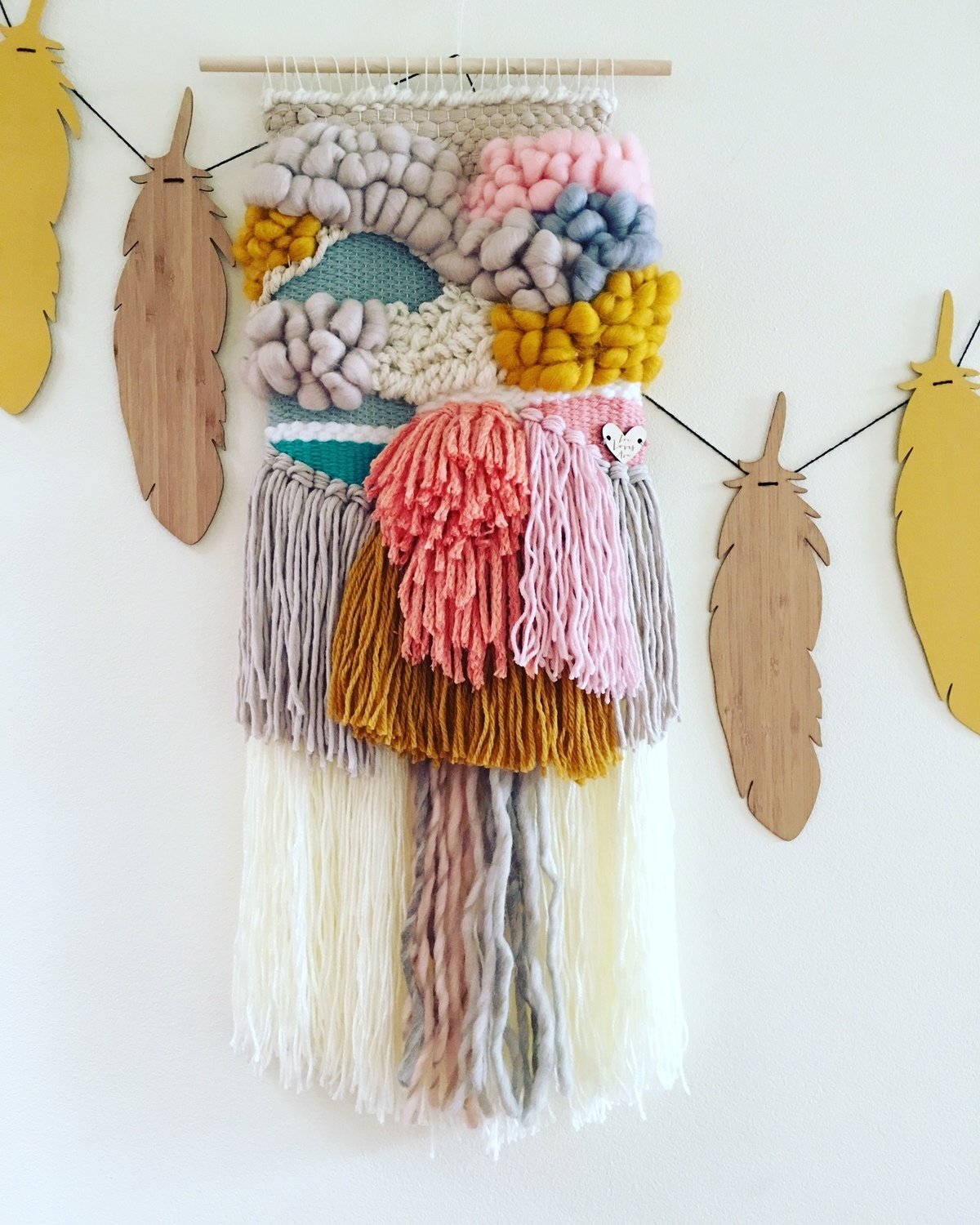 Small  woven wall hanging 25 cm wide.