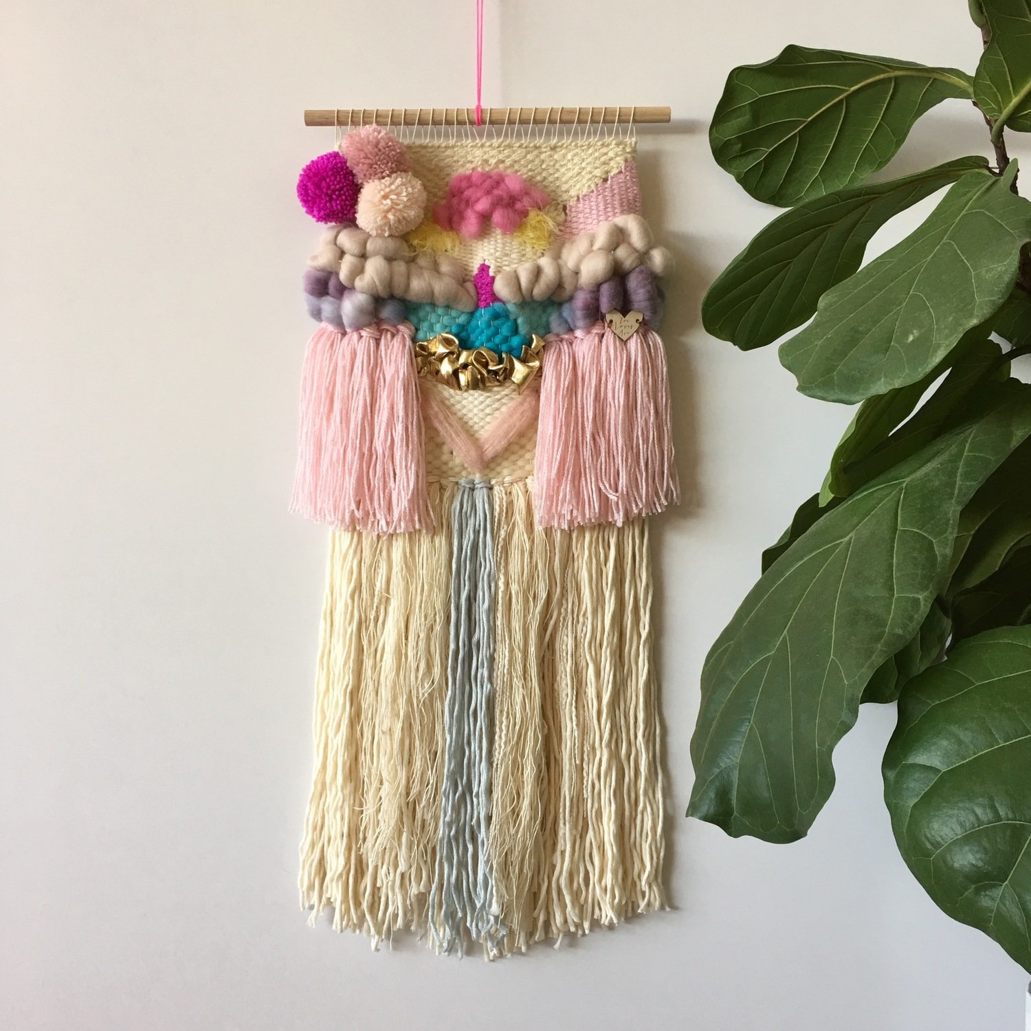 Small  woven wall hanging 25 cm wide.