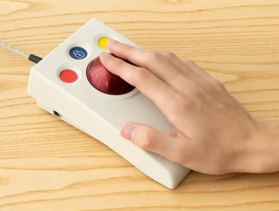 Image showing a hand resting on the optima trackball