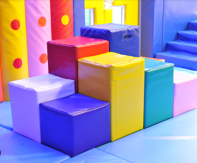 Various padded shapes for use as obstacles in a sensory gym or soft play gross motor therapy room.