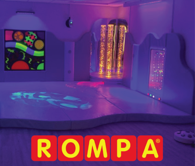 A Rompa Sensory Room showing UV wall panel, corner Bubble Tube, Infinity Wall Panel, Padded Flooring and projection.