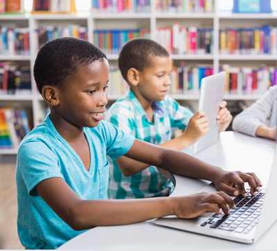 Two boys in a computer lab.