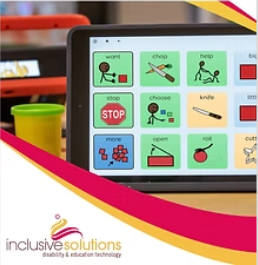 A tablet showing symbol based communication software on a class desk.