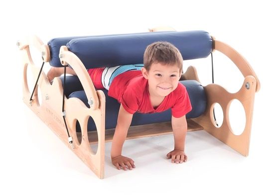 Sensory Therapeutic Body Roller with a child moving through the rollers