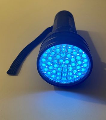 Switched on black UV LED torch
