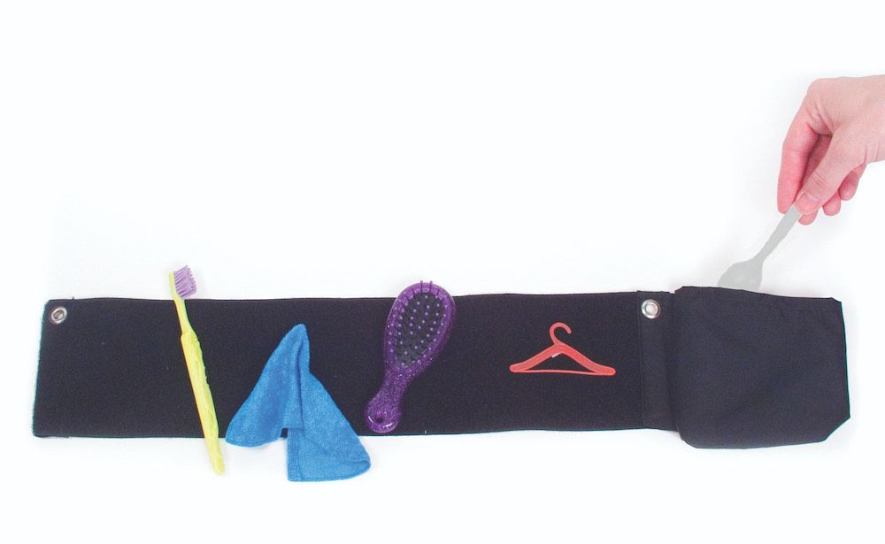 Velcro sensitive fabric strip with small items attached to it