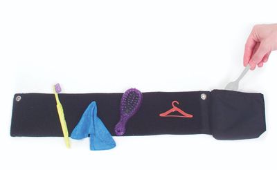 Velcro sensitive fabric strip with small items attached to it