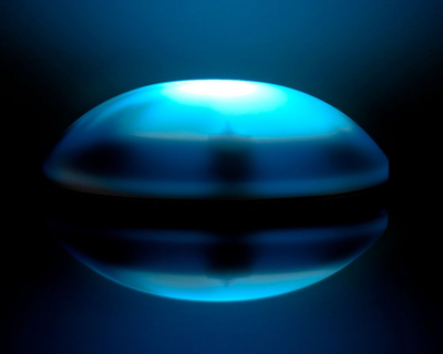 Image of round dome-shaped Vibe-Lite switch lit up