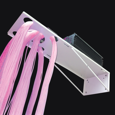 Image of a white metal wall fibre optic support bracket holding fibre optic strands