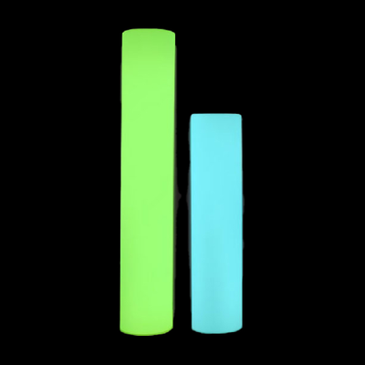 Two LED lit cylinders side by side. One lit in green, one lit in blue