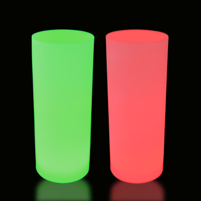 Two LED lit cylinders side by side. One lit in green, one lit in red