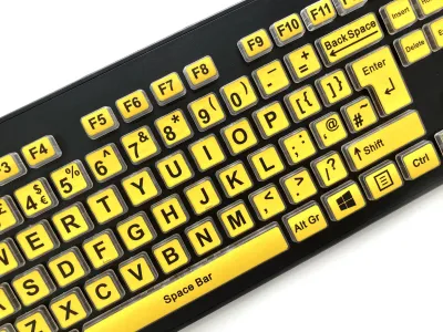 Close up view of the Accuratus Rainbow keyboard with yellow keys and bold black text