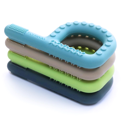 Set of four P-shaped chews in different colours stacked