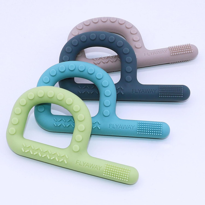 Set of four P-shaped chews in different colours