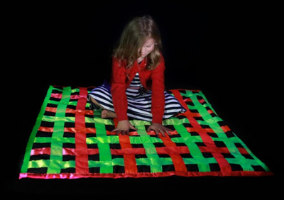 Child sitting on UV mat