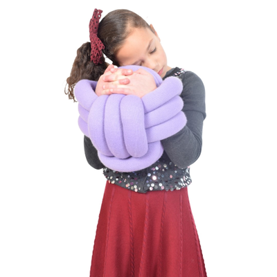 Image of a girl holding a large cuddle ball