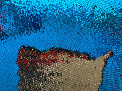 Close up view of reversible sequins on sequin wall boards