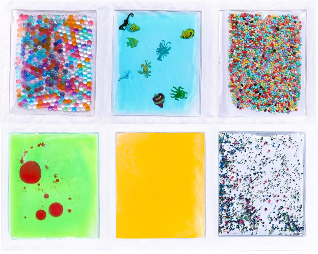 Image of lap and floor tactile pad with six pockets filled with different textures