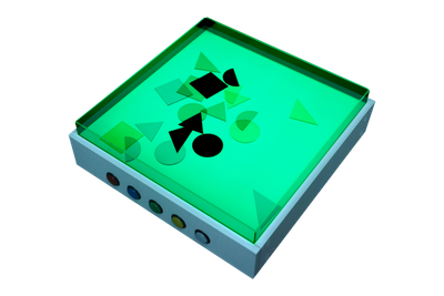 Top view of the light table with sand table top lit in green