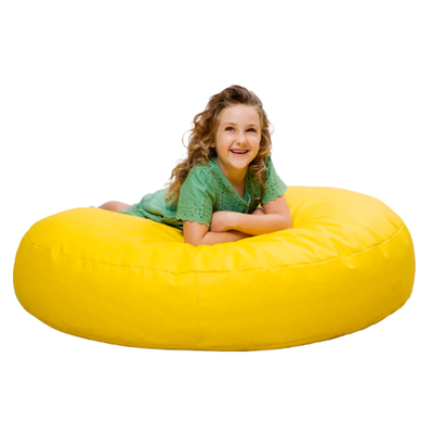Image of a girl on a large yellow pouf