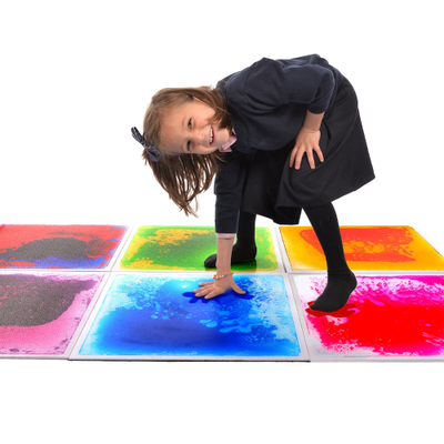 Image of a child standing on a set of 6 liquid floor tiles