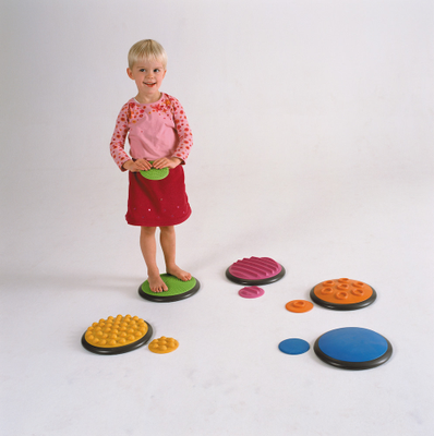 Image of a child standing on a tactodisc from set 1