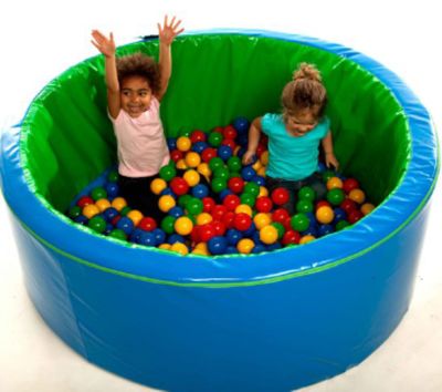 Image showing a round ball pond with coloured balls and two children inside