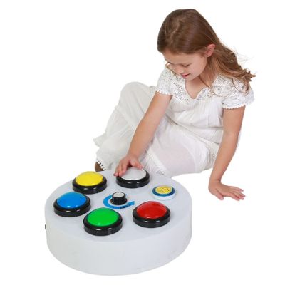 Image of child sitting next to large button controller